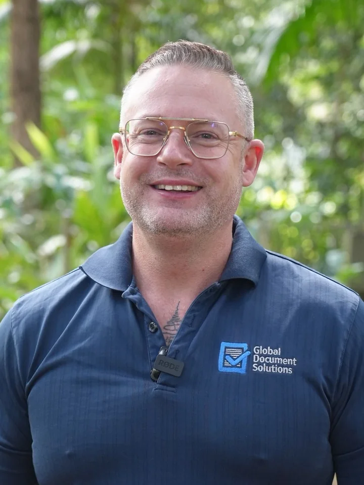 Cyrus Dickie, Founder of Global Document Solutions Pty Ltd, wearing a Global Document Solutions branded shirt